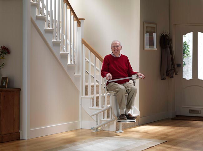 A stairlift at home to traverse the stairs could help your parents age in place
