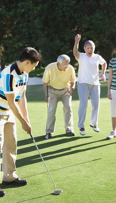 Family enjoys a round of golf together
